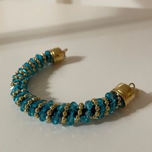Cord bracelet with turquoise crystals and gold tinted beads - gold tinted clasp
